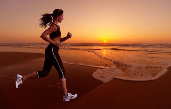 woman-running-on-beach Woman running on beach.